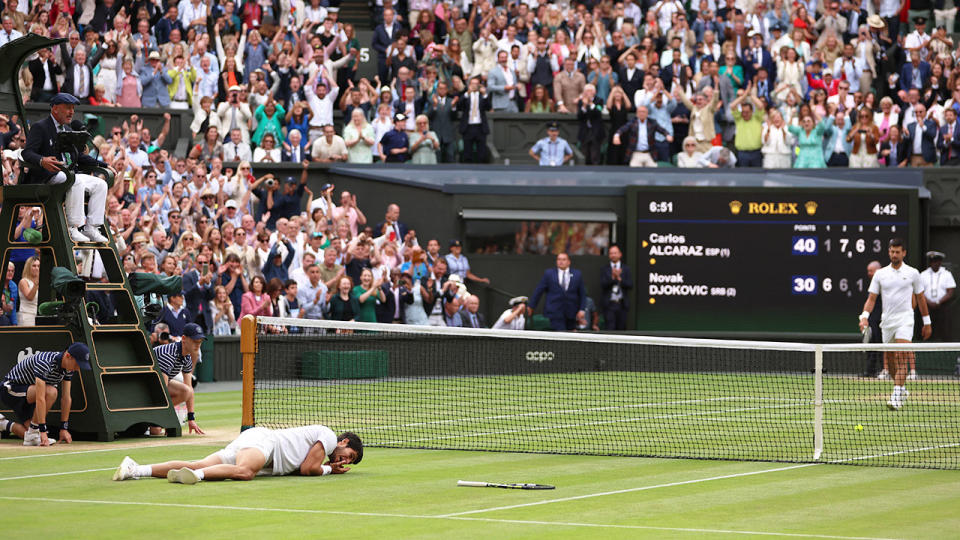 The Wimbledon crowd rose as one after Carlos Alcaraz beat Novak Djokovic to win the men's title. Pic: Getty