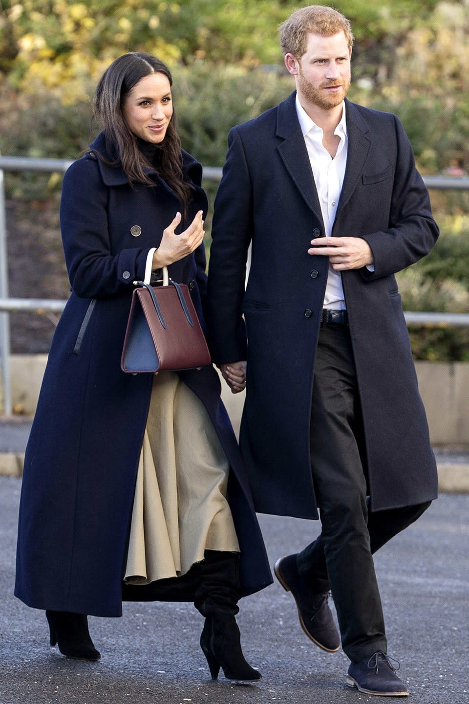 Wearing a Mackage coat and carrying a Strathberry bag.