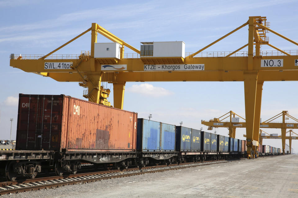 Containers are seen near cranes at the Khorgos Gateway, one of the world's largest dry dock in a remote crossing along Kazakhstan's border with China near Khorgos, on April 2, 2018. China gave strong verbal backing to Kazakhstan's leader for a deadly crackdown to quell violent unrest - but stood aside as Russia sent in special forces troops. (AP Photo/Ng Han Guan, File)