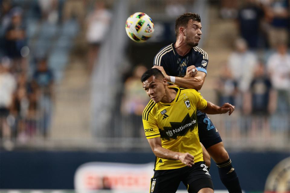 Aug 28, 2024; Philadelphia, Pennsylvania, USA; Philadelphia Union defender Kai Wagner (27) heads the ball over Columbus Crew defender Marcelo Herrera (2) in the first half at Subaru Park. Mandatory Credit: Caean Couto-USA TODAY Sports