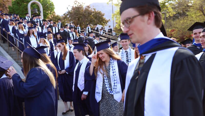 BYU students enter the Marriott Center in Provo for their commencement ceremony on Thursday, April 25, 2024.