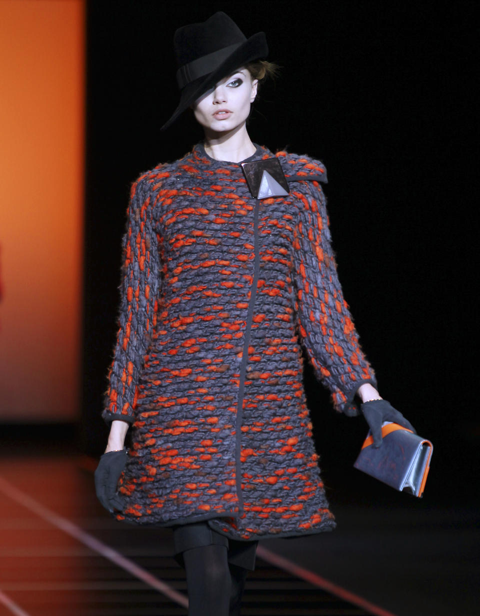 A model wears a creation part of the Giorgio Armani Women's Fall-Winter 2012-13 fashion collection, during the fashion week in Milan, Italy, Monday, Feb. 27, 2012. (AP Photo/Antonio Calanni)