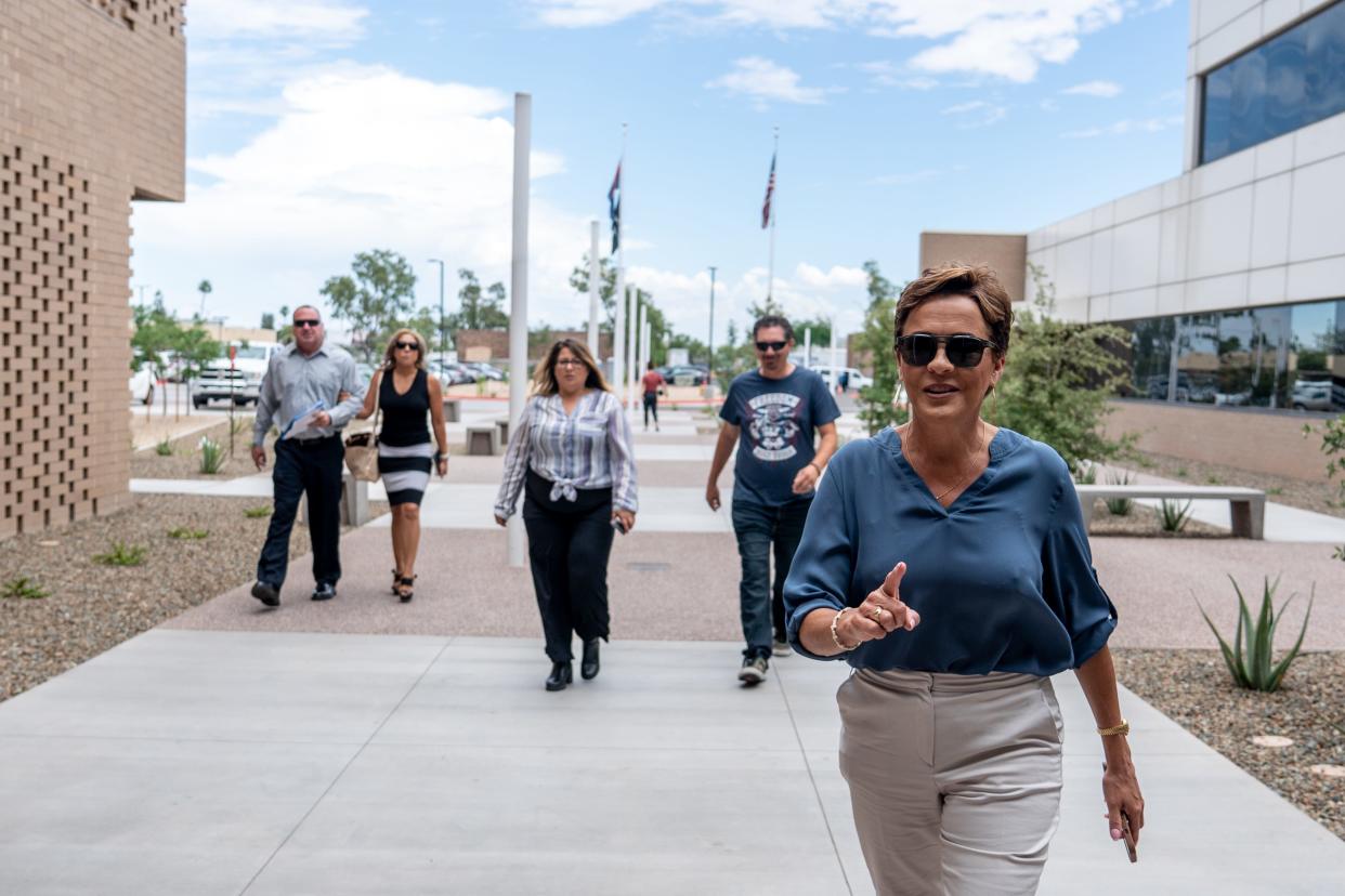 Kari Lake walks toward Maricopa County Superior Court to observe closing arguments during her election challenge trial in Mesa on May 19, 2023.