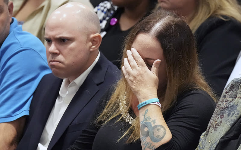 Ilan and Lori Alhadeff, center, react as they hear that their daughter's murderer will not receive the death penalty