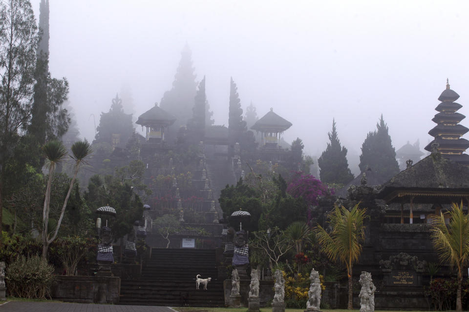 <p>Bali’s most prominent temples, called Pura Besakih and located a few kilometers away from the mountain’s slopes, are seen in the fog, Bali, Indonesia, Sept. 25, 2017. More than 35,000 people have fled a menacing volcano on the Indonesia tourist island of Bali, fearing will erupt for the first time in more than half a century as increasing tremors rattle the region. (AP Photo/Firdia Lisnawati) </p>