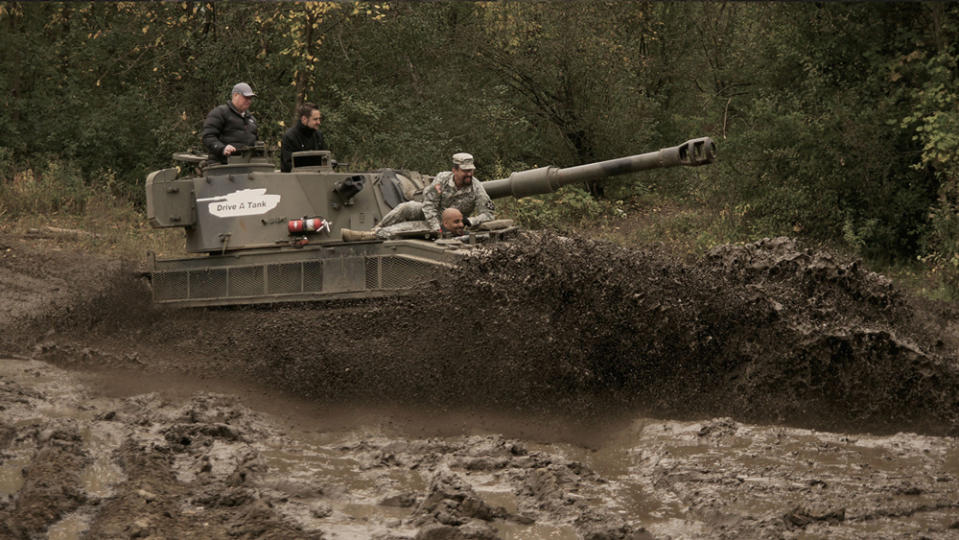 Operating a tank at Drive a Tank in Kasota, Minn.