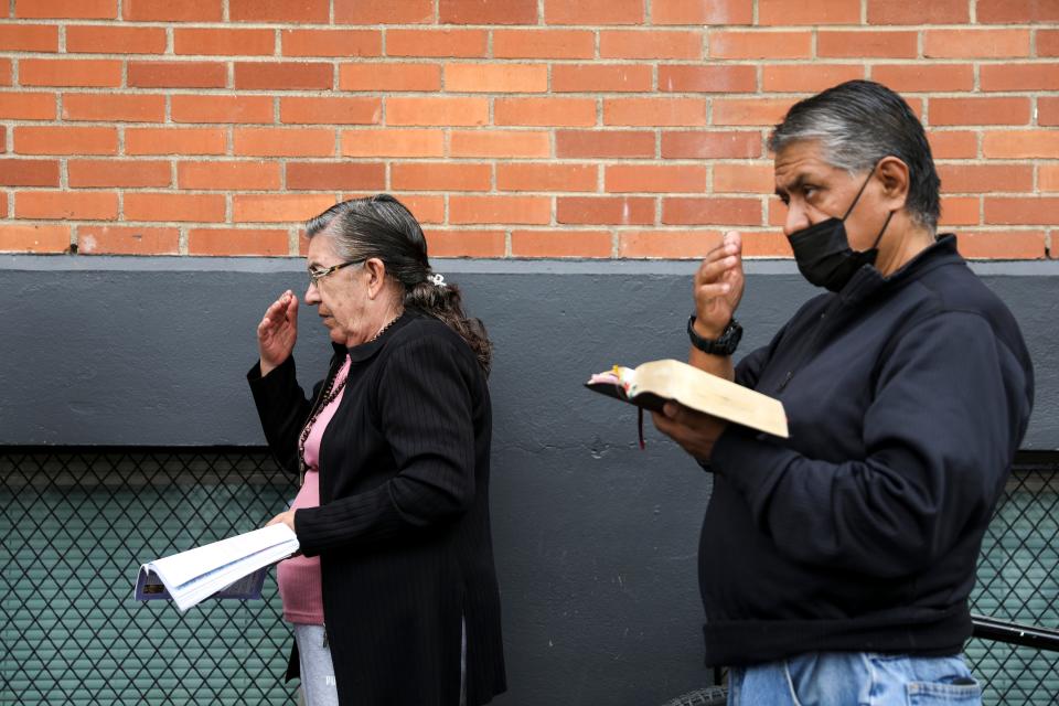 St. Joseph Catholic Church meets for mass outside as they still recover from a fire that damaged the sanctuary on Wednesday, Sept. 20, 2023 in Salem, Ore. The church has continued their services under a tent in the parking lot.