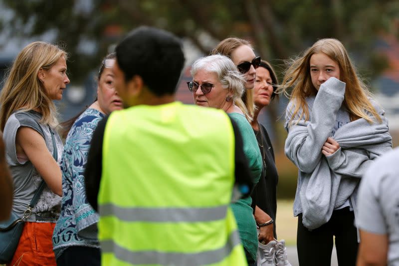 Relatives of the volcano eruption victims react after attending a ceremony called "Karakia" with Ngati Awa representatives, at Mataatua Marae house in Whakatane