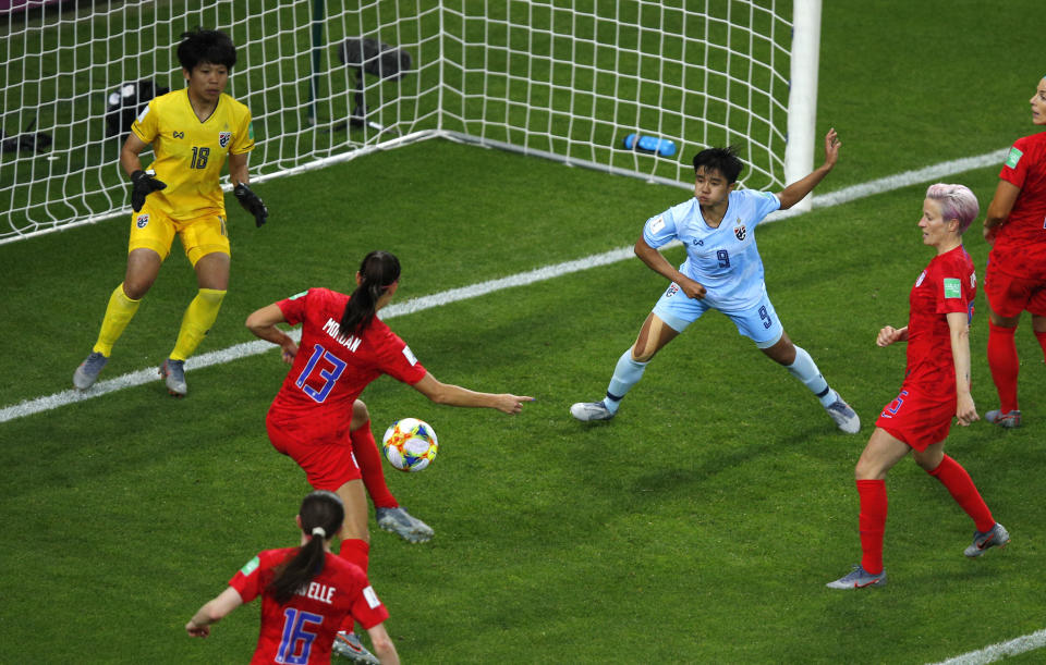 FILE - United States' Alex Morgan, centre, scores her team's fifth goal during the Women's World Cup Group F soccer match between the United States and Thailand at the Stade Auguste-Delaune in Reims, France, June 11, 2019. The Thailand women's soccer team endured the biggest-ever loss at a women's soccer World Cup, in June 2019, a 13-0 trouncing by the United States which cast an unwelcome spotlight on the state of the sport in the South East Asian nation. Now a refurbished Thailand team under a new head coach and with the youngest playing group in its history has played Cameroon in an inter-continental playoff match in New Zealand, hoping to qualify again for a World Cup and move beyond the shadow of that defeat. (AP Photo/Francois Mori,File)