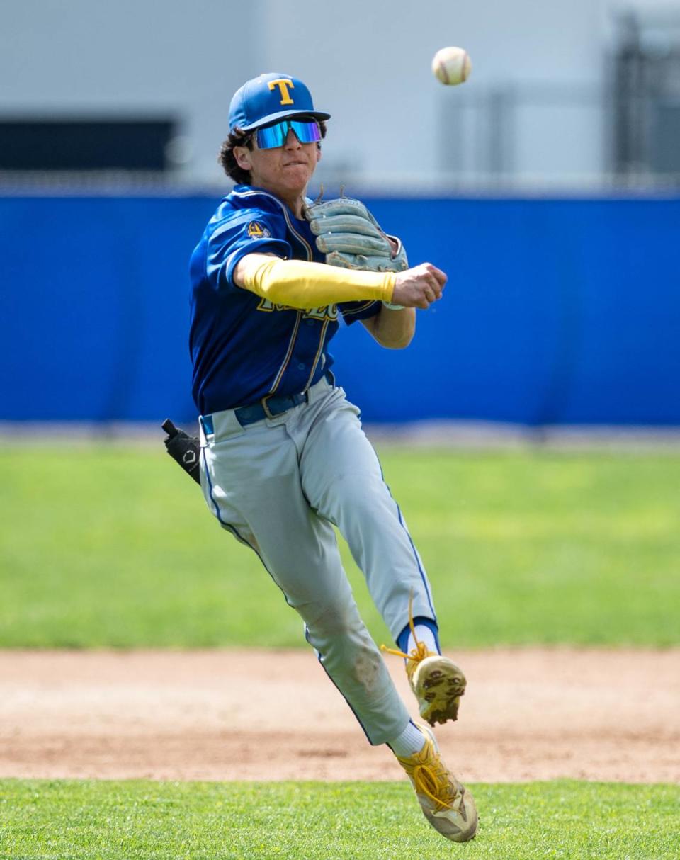 Turlock shortstop Josh Ramirez throws out a runner during the Central California Athletic league game at Downey High School in Modesto, Calif., Thursday, March 23, 2023.