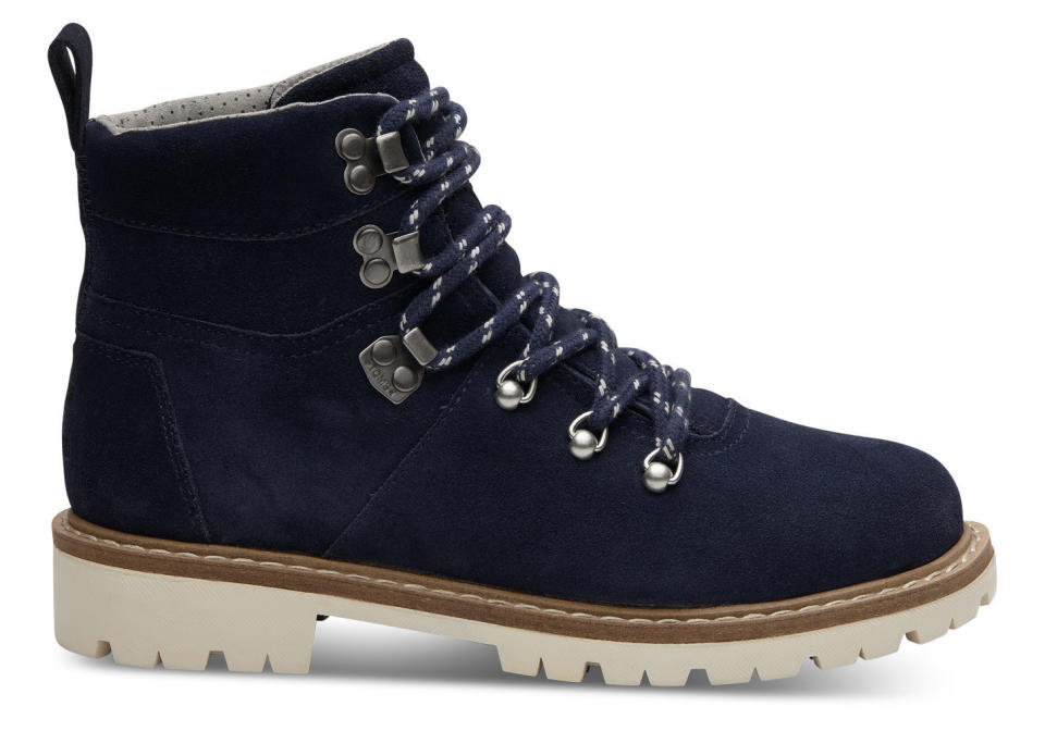 Get them <a href="http://www.toms.com/women/waterproof-navy-suede-womens-summit-boots" target="_blank">here</a>.