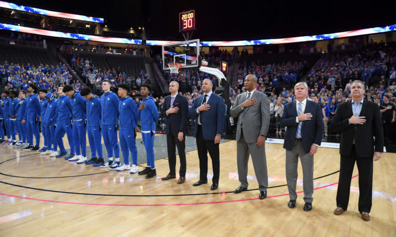 Kentucky's coaching staff including assistant Kenny Payne, now with the New York Knicks, and players lined up.