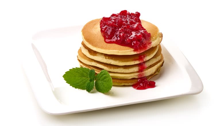Pancakes topped with cranberry sauce