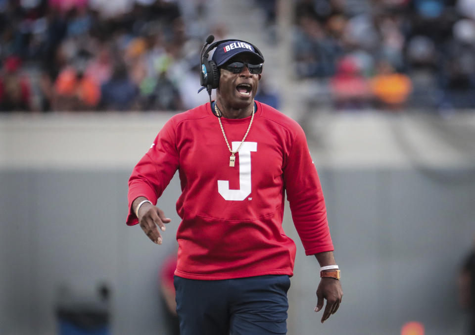 FILE - Jackson State coach Deion Sanders gets his team's attention during the Southern Heritage Classic NCAA college football game against Tennessee State, Saturday, Sept. 10, 2022. Deion Sanders confirmed Monday, Nov. 28, the University of Colorado is among multiple head coaching jobs he’s been offered.(Patrick Lantrip/Daily Memphian via AP, File)