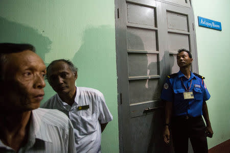 A policeman stands guard at the forensic department of a hospital where the body of Ko Ni is kept, a prominent member of Myanmar's Muslim minority and legal adviser for Myanmar's ruling National League for Democracy, in Yangon, Myanmar, January 29, 2017. Picture Taken January 29, 2017. REUTERS/Aung Kyaw Htet EDITORIAL USE ONLY. NO RESALES. NO ARCHIVE.