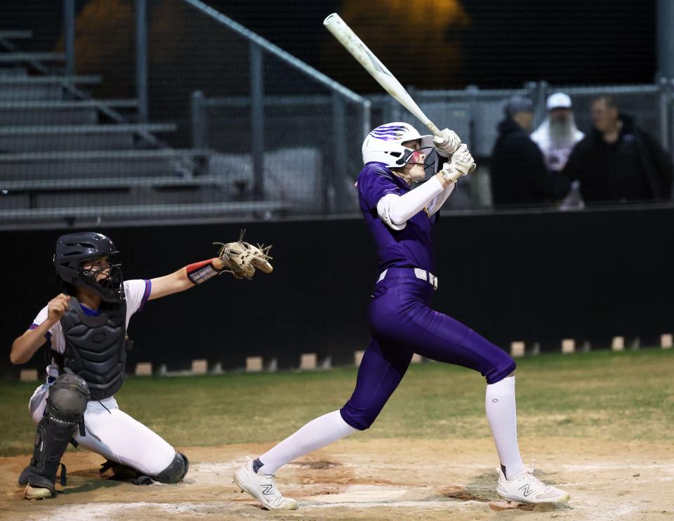 Liberty Hill's Rylee Slimp strokes a hit for the Panthers during their game at Leander last month. Liberty Hill finds itself in the thick of their district race as the high school softball season nears the end of the regular season.