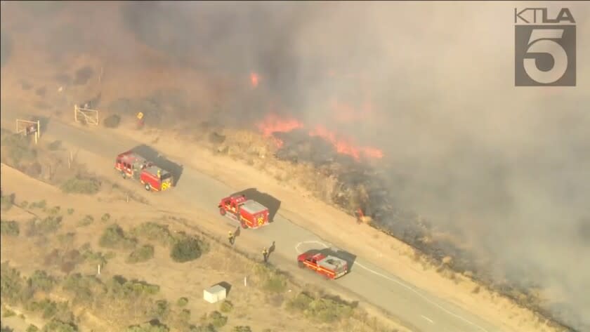 A brush fire in Castaic grew to at least 50 acres and threatened an animal shelter Wednesday evening. Crews on the Quail fire reported a medium rate of spread, but no evacuations had been ordered as of around 6:30 p.m., said Capt. Abraham Serrano, of the Los Angeles County Fire Department.