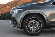 <p>As with every AMG, subtlety wins the day. The Panamericana straight-bar grille reappears above more aggressive chin spoilers, the fenders thicken, and the quad-piped exhaust tips (with optional <em>brrrapp-blat-blat</em> sounds) flank a faux venturi splitter.</p>