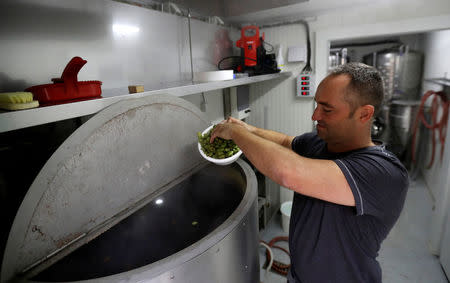 Radek Spacil, co-owner of the "Smart Brewery", brews a beer in a portable brewery built in a standard shipping container, in Prague, Czech Republic, September 2, 2017. Picture taken September 2, 2017. REUTERS/David W Cerny