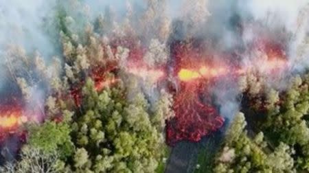 Lava emerges from the ground after Kilauea Volcano erupted, on Hawaii's Big Island May 3, 2018, in this still image taken from video obtained from social media. Picture taken May 3, 2018. Jeremiah Osuna/via REUTERS