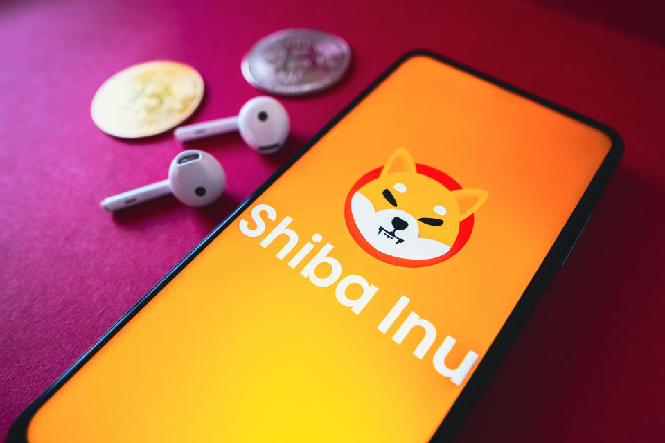 BRAZIL - 2022/06/26: In this photo illustration, the Shiba Inu (SHIB) logo seen displayed on a smartphone screen, next to two cryptocurrencies and headphones. (Photo Illustration by Rafael Henrique/SOPA Images/LightRocket via Getty Images)