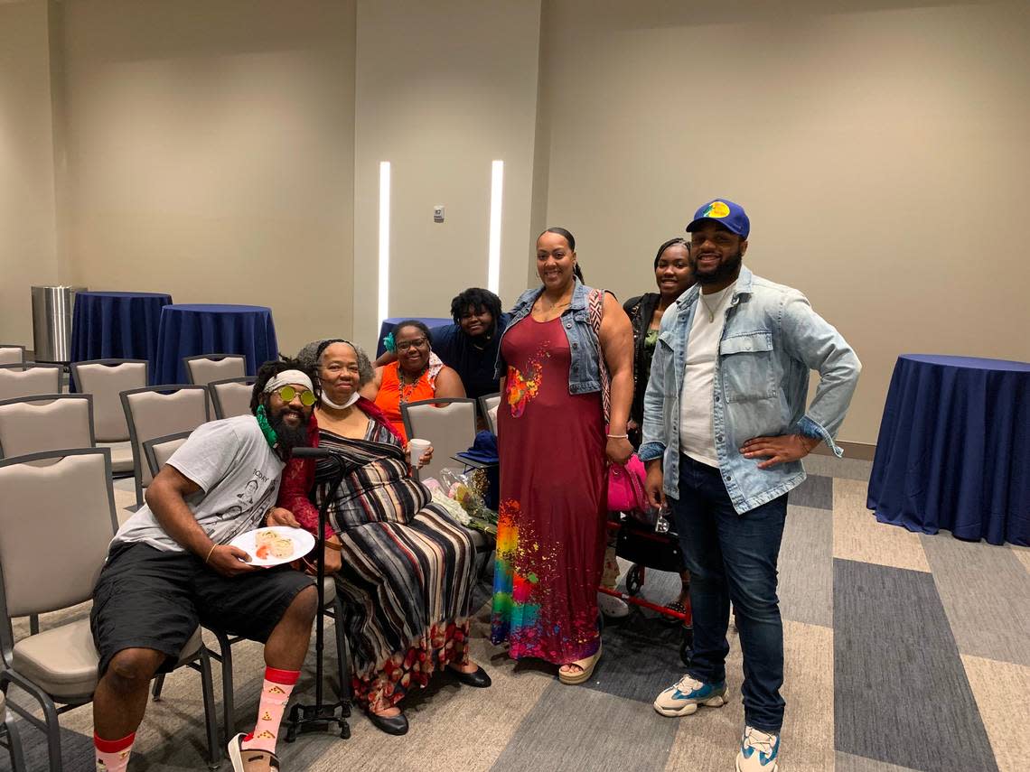 LaCreisha Watson gathers with her family after graduating from the Early Childhood Education Apprentice Program in Fort Worth. The program, run by Camp Fire First Texas. is the first of its kind in Texas.