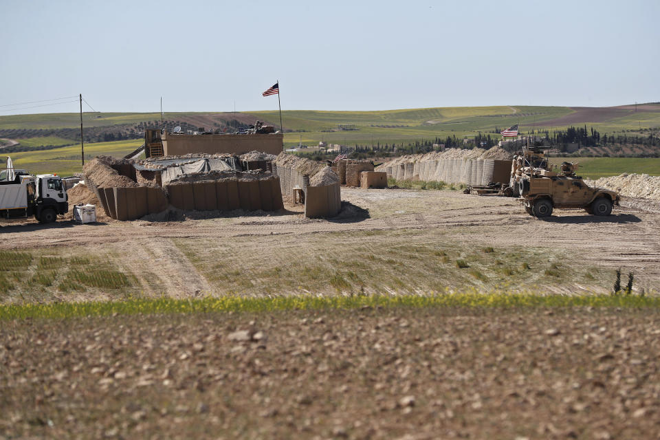 FILE - This Wednesday, April 4, 2018, file photo shows a U.S. position, installed near the tense front line between the U.S-backed Syrian Manbij Military Council and the Turkish-backed fighters, in Manbij, north Syria. The planned U.S. troop withdrawal opens a void in the north and east of Syria, and the conflicts and rivalries among all the powers in the Middle East are converging to fill it. (AP Photo/Hussein Malla, File)