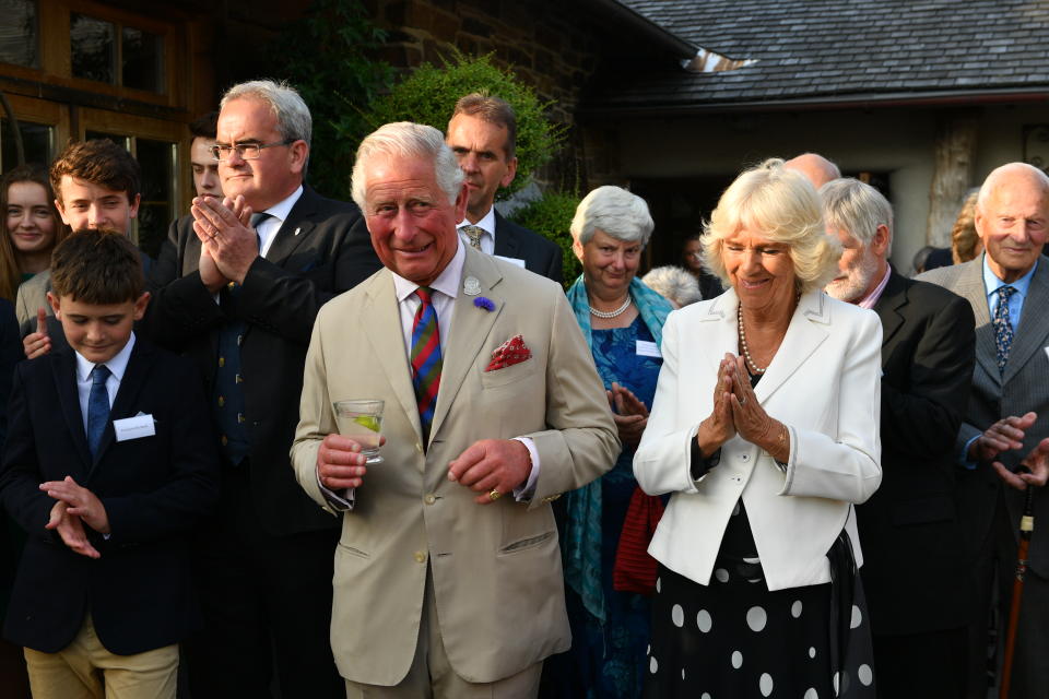 LOSTWITHIEL, ENGLAND - JULY 16: Prince Charles, Prince of Wales and Camilla, Duchess of Cornwall attend a reception to celebrate the 50th Anniversary of his chairmanship of the Duchy of Cornwall Prince's Council at the Duchy of Cornwall Nursery in Cott Rd, during an official visit to Devon & Cornwall on July 16, 2019 in Lostwithiel, United Kingdom. (Photo by Ben Birchall - WPA Pool/Getty Images)