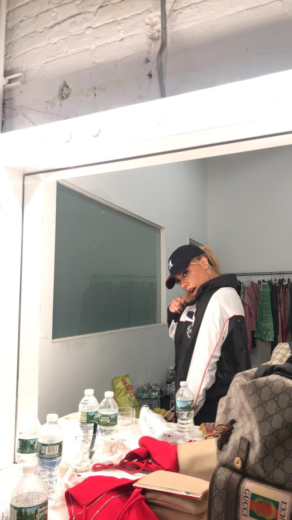 <p>"Behind the scenes: getting ready for my first Bottled Up performance at <em>Teen Vogue</em>'s NYFW party."</p> <p><em>Dinah takes a moment to reflect before hitting the stage for an unforgettable performance at the Body Party event.</em></p>