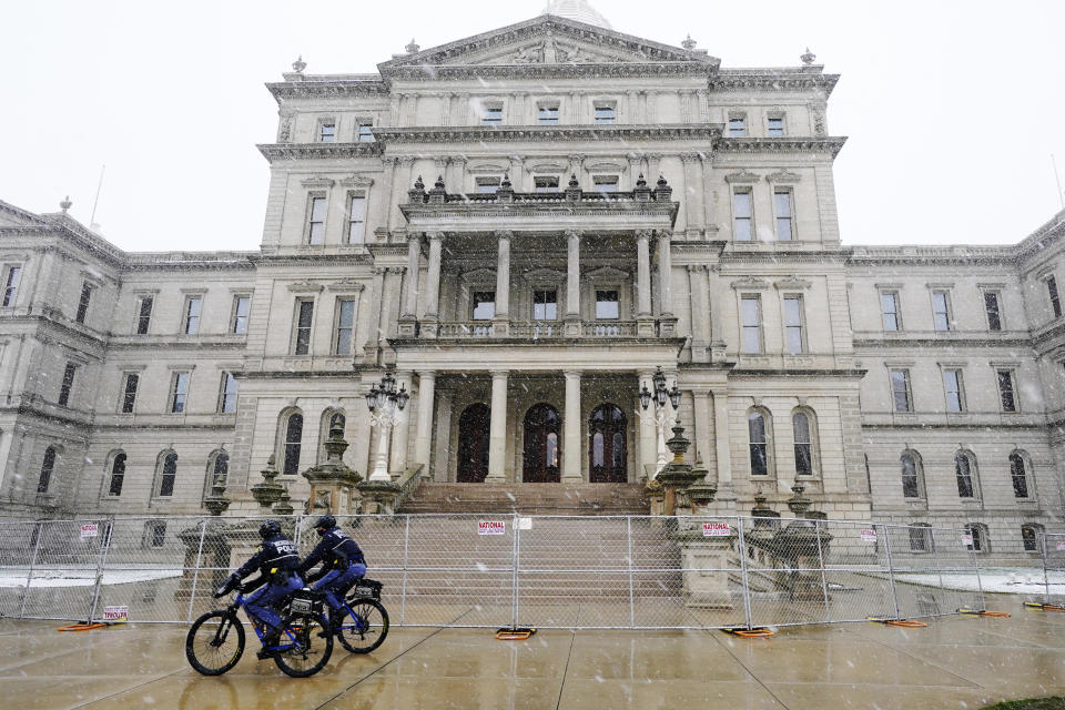 Michigan State Police officers patrol outside the state Capitol in Lansing, Michigan, Friday, January 15, 2021 / Credit: Carlos Osorio / AP