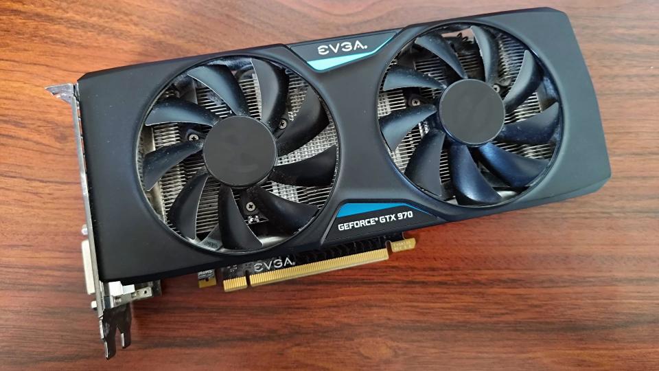 EVGA GTX 970 sitting on woodgrain desk