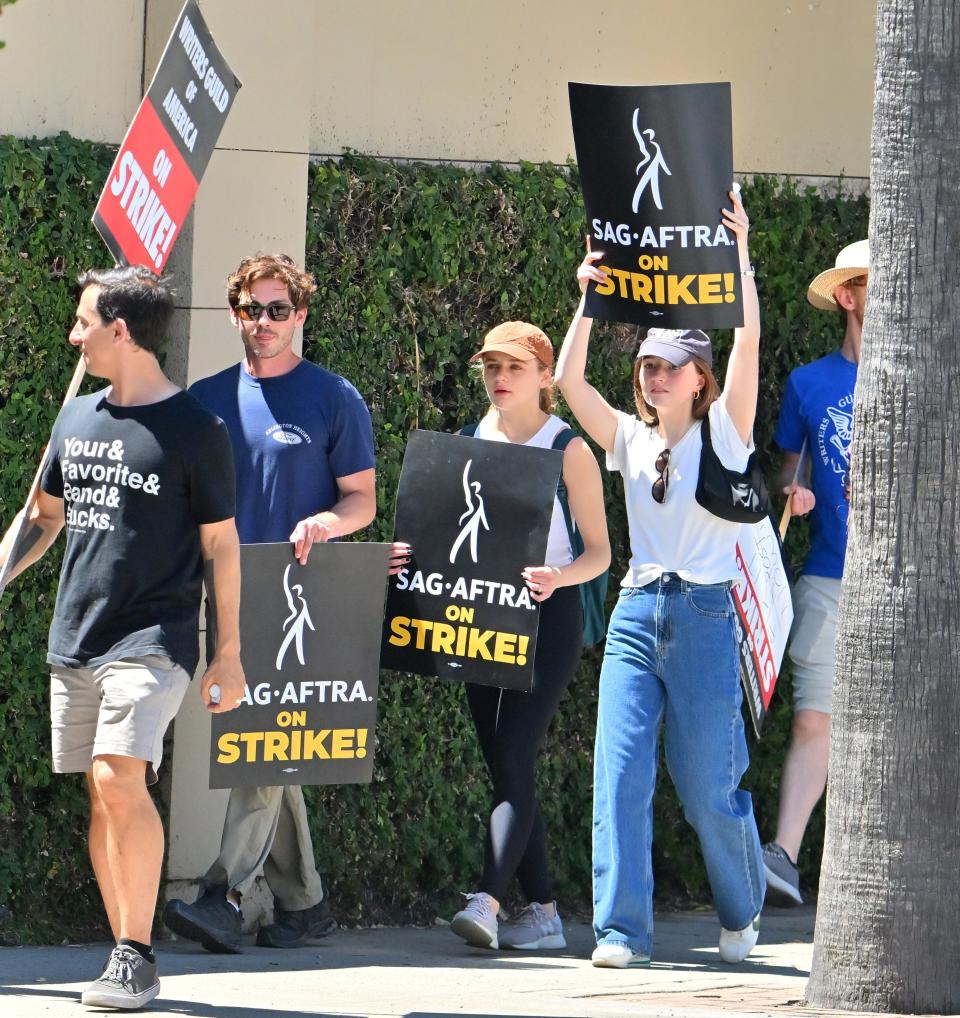 Logan Lerman, Kaitlyn Dever, and Joey King seen at the SAG strike on July 14, 2023 in Los Angeles, California.