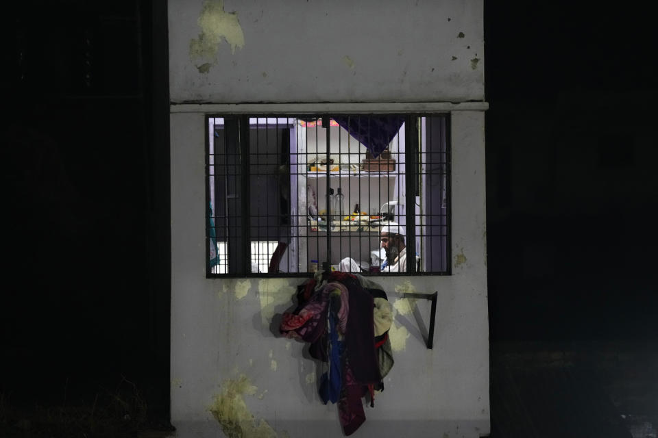 A Muslim man rests in his house after breaking Ramadan fast in Ayodhya, India, March 28, 2023. India, a country of more than 1.4 billion people is on the cusp of becoming the world's most populated nation. But most of the Hindus and Muslims embody the opposing sides of a deeply entrenched religious divide that presents India one of its biggest challenges so far: to safeguard freedoms to its Muslim minority at a time when a rising tide of Hindu nationalism is laying waste to the country's secular underpinnings.(AP Photo/Manish Swarup)