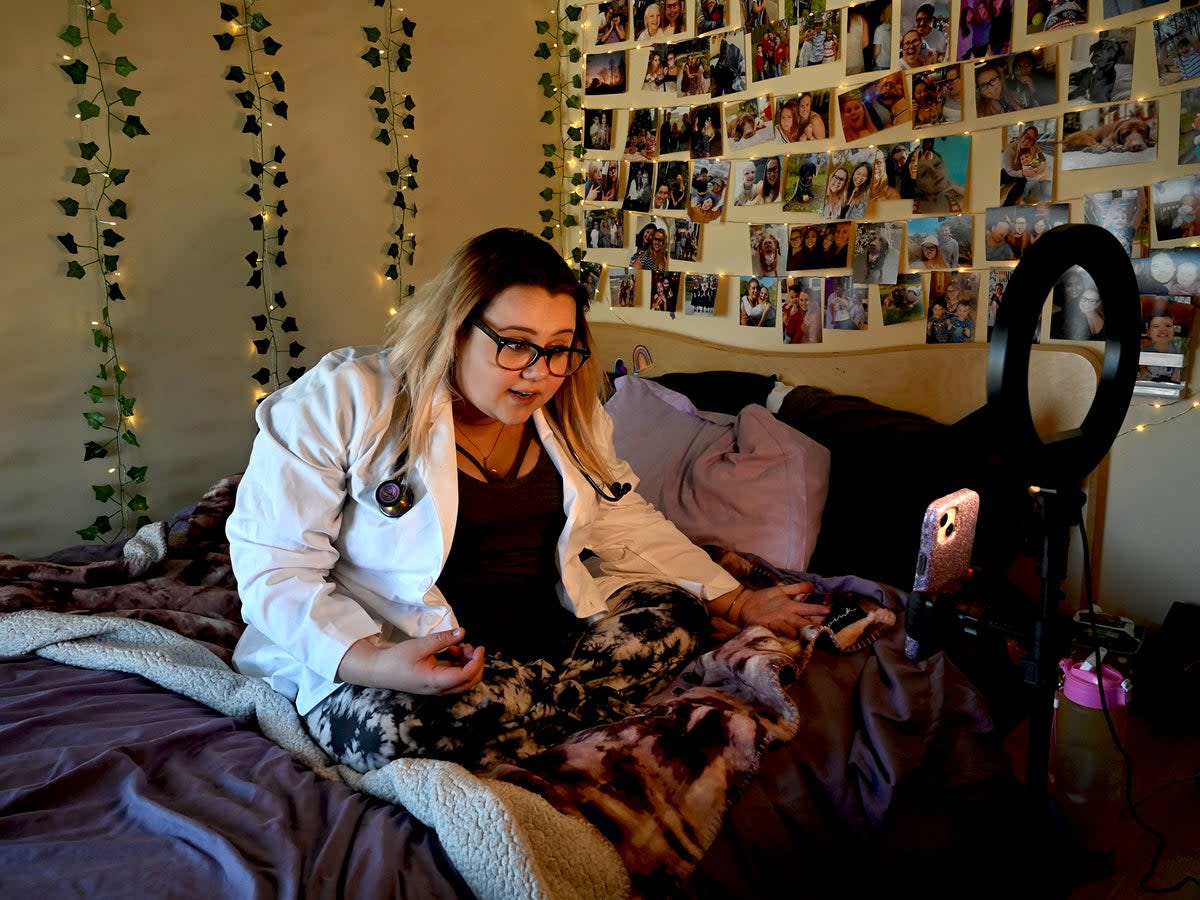 Nicole Spencer, who suffers from Postural Orthostatic Tachycardia Syndrome, prepares to record a video for her Instagram account (Reuters)