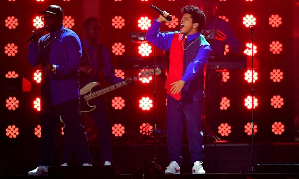 Bruno Mars, right, performs at the Brit awards.