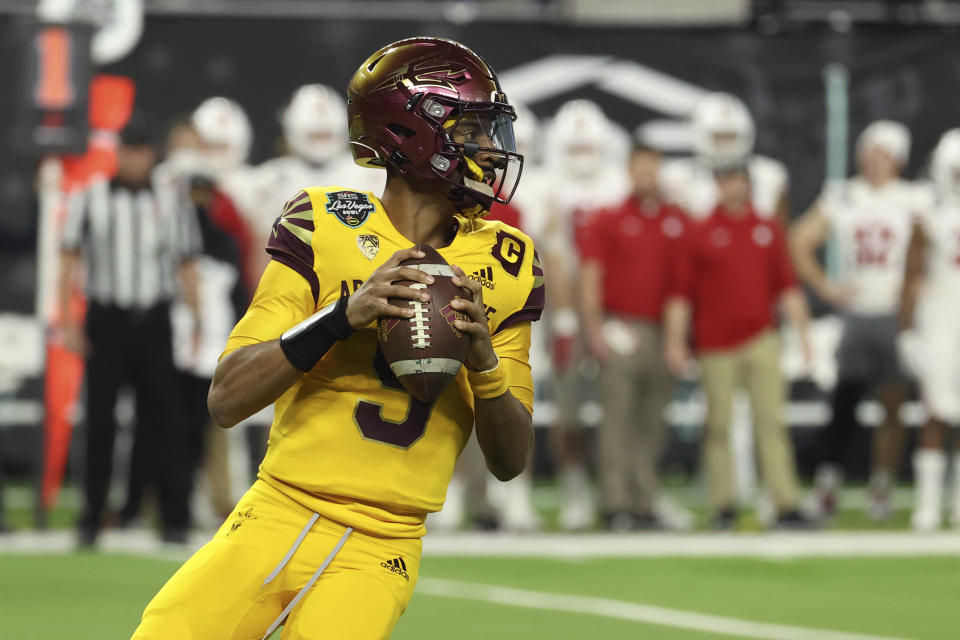 Arizona State quarterback Jayden Daniels (5) looks to pass against Wisconsin during the first half of the Las Vegas Bowl NCAA college football game Thursday, Dec. 30, 2021, in Las Vegas. (AP Photo/L.E. Baskow)