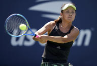 FILE - Peng Shuai, of China, returns a shot to Maria Sakkari, of Greece, during the second round of the US Open tennis championships on ug. 29, 2019, in New York. China's Foreign Ministry is sticking to its line that it isn't aware of the controversy surrounding tennis professional Peng Shuai, who disappeared after accusing a former top official of sexually assaulting her. A ministry spokesperson said Friday that the matter was not a diplomatic question and that he was not aware of the situation. (AP Photo/Michael Owens, File)