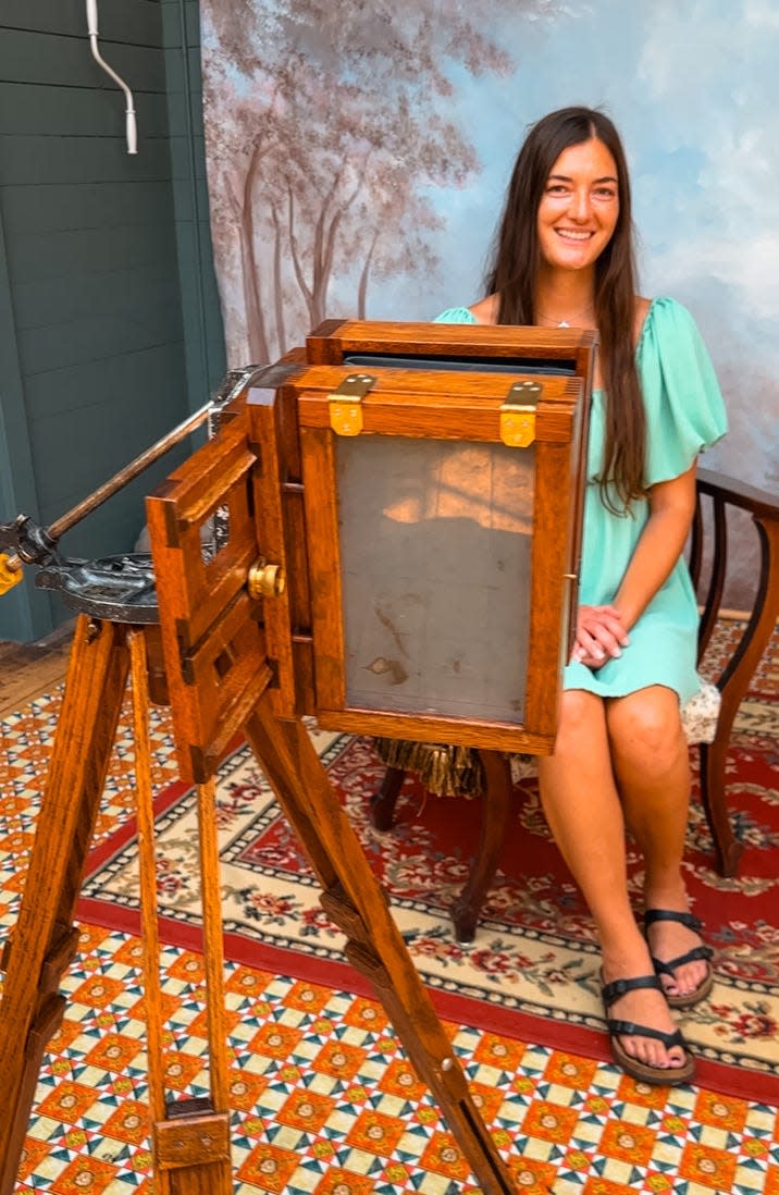 Haley Dolata gets a tintype photo at the H.H. Bennett Studio in Wisconsin Dells during a Wisconsin history road trip with her sister, Julia Sivers.