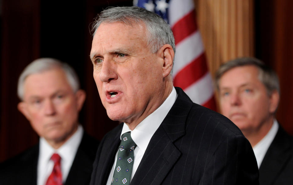 FILE PHOTO - U.S. Senator Jon Kyl (R-AZ) (C) leads a news conference about his opposition to moving forward on a vote to ratify the START treaty during the current lame duck session, at the U.S. Capitol in Washington, December 21, 2010. Also pictured are Senator Jeff Sessions (R-AL) (L) and Senator Lindsey Graham (R-SC) (R). To Match Special Report USA-NUCLEAR/MODERNIZE REUTERS/Jonathan Ernst/File Photo