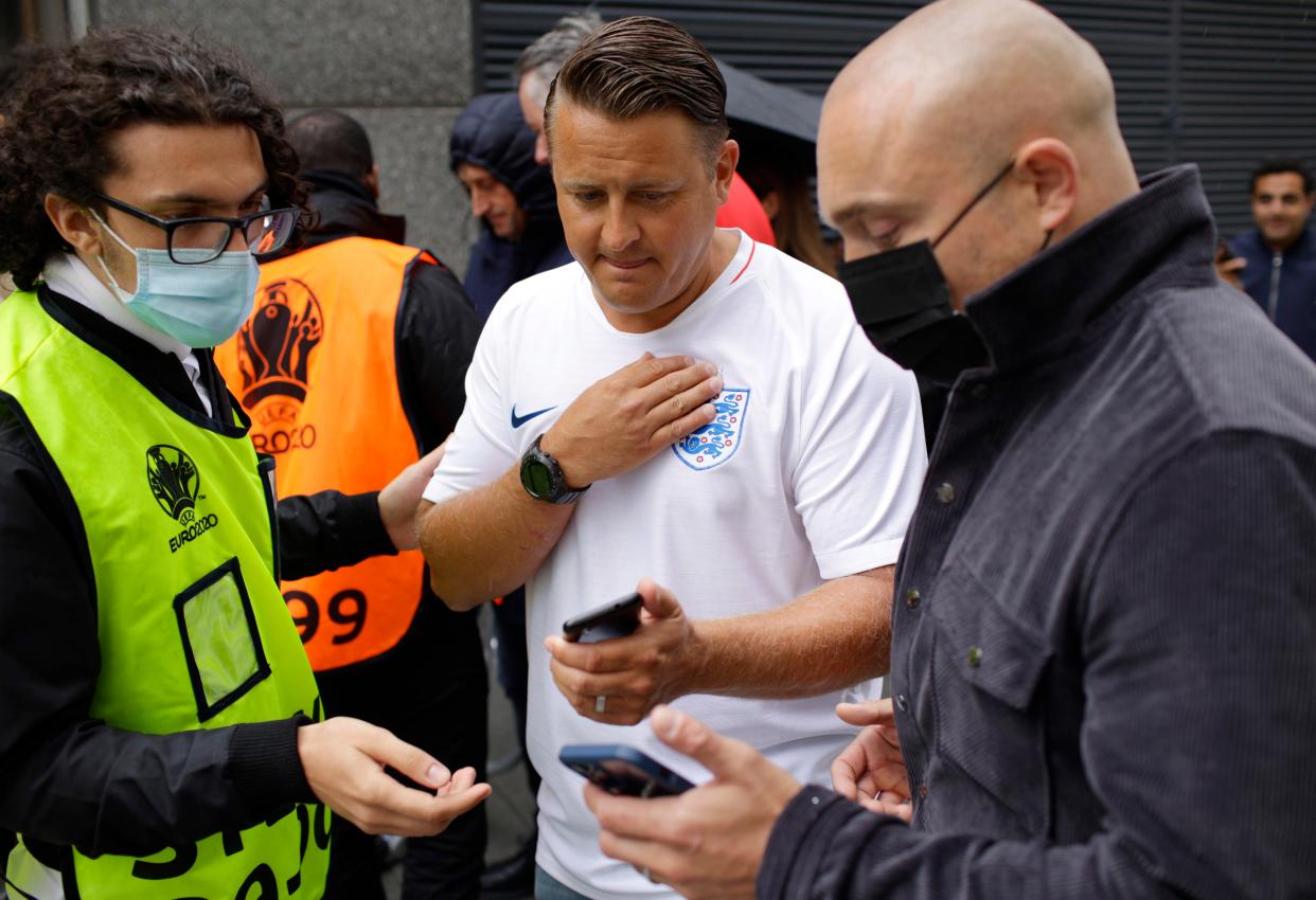 Stewards check Covid passes at Wembley (AP)