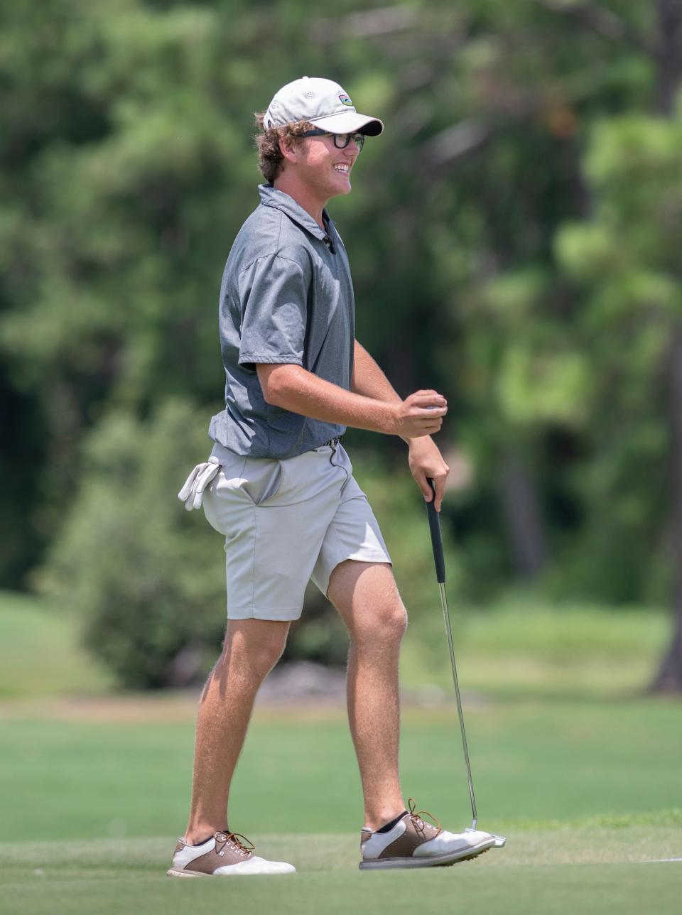 Jack Wallace, of Cantonment, reacts to sinking his putt during the Divot Derby at Tiger Point Golf Club in Gulf Breeze on Wednesday, July 20, 2022.
