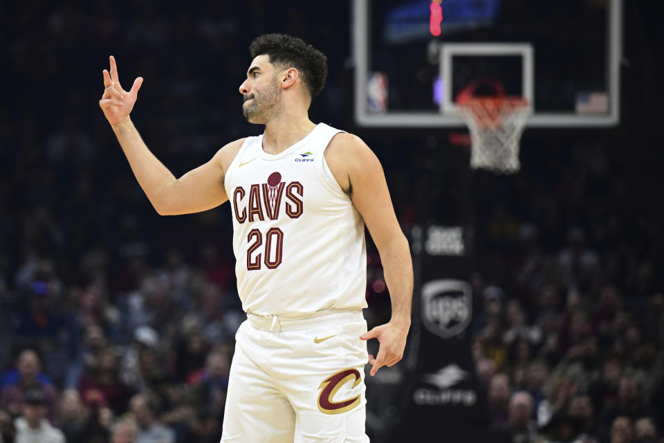 Cleveland Cavaliers forward Georges Niang reacts after a 3-point basket against the New Orleans Pelicans duirng the first half of an NBA basketball game Thursday, Dec. 21, 2023, in Cleveland. (AP Photo/David Dermer)