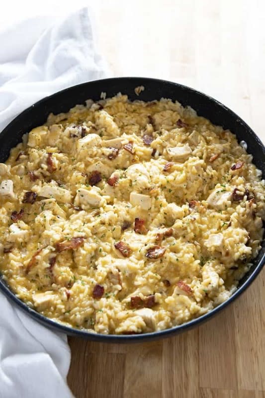 Bacon ranch one-pot chicken and rice casserole - the easiest and most flavorful chicken and rice recipe ever! Packed full of juicy chicken, crisp bacon, ranch, rice, and gooey cheese!<p><strong>Get the recipe: <a href="https://thesaltymarshmallow.com/bacon-ranch-one-pot-chicken-and-rice/" rel="sponsored" target="_blank" data-ylk="slk:Bacon Ranch One-Pot Chicken and Rice Casserole;elm:context_link;itc:0;sec:content-canvas" class="link ">Bacon Ranch One-Pot Chicken and Rice Casserole</a></strong></p>