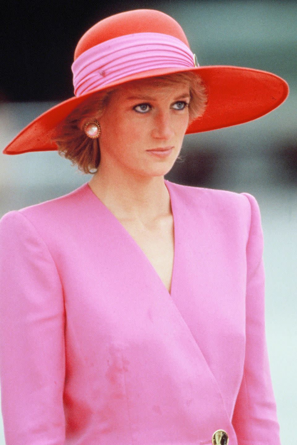 <p>Wearing a pink-and-orange Philip Somerville hat in Kuwait City.</p>