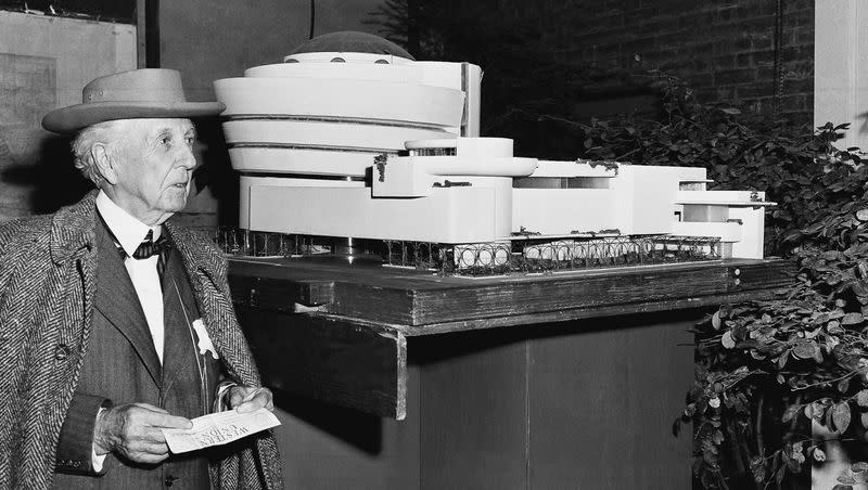Architect Frank Lloyd Wright poses beside a model of the new home he designed for the Solomon R. Guggenheim Museum in New York City on Oct. 25, 1953. The museum will be the first permanent building by the world-renowned architect in New York City. The model is on view at an exhibition, “Sixty Years of Living Architecture,” tracing Wright’s many innovations in architecture, in a temporary pavilion at the museum.