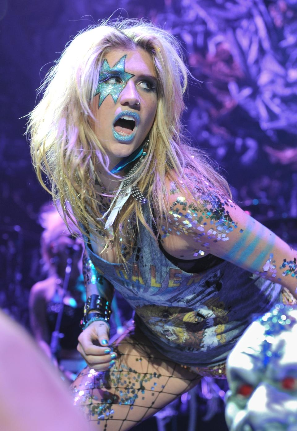 FILE - Singer Ke$ha performs at the Casio Shock the World 2010 event in New York on Aug. 2, 2010. Kesha's song, “TiK ToK,” the drunken party anthem and multi-platinum debut single, a song that dominated the year in music, didn’t garner a nomination at the Grammys. (AP Photo/Louis Lanzano, File)