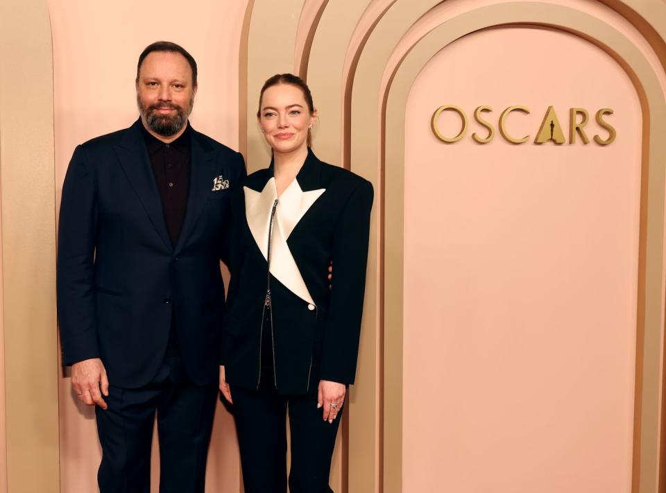 yorgos lanthimos and emma stone at the 96th oscars nominees luncheon