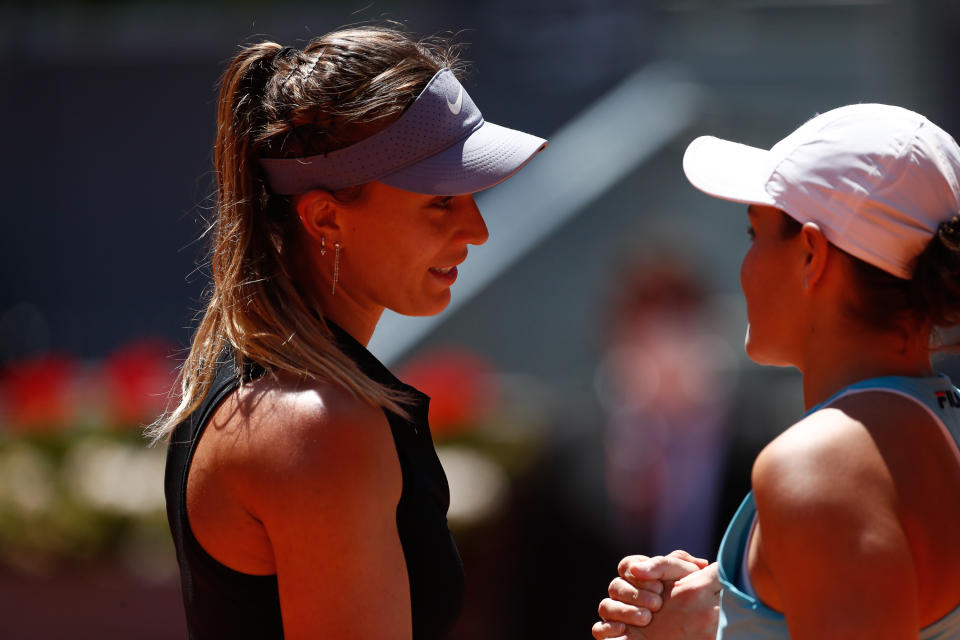 Paula Badosa (pictured left) congratulates Ash Barty (pictured right) at the net of the Madrid Open.