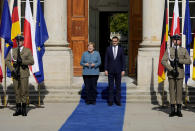 German Chancellor Angela Merkel, left, meets Poland's Prime Minister Mateusz Morawiecki in Warsaw, Poland, Saturday, Sept.11, 2021.Merkel is visiting the Polish capital Morawiecki at a time when Poland faces migration pressure on its eastern border with Belarus. (AP Photo/Czarek Sokolowski)