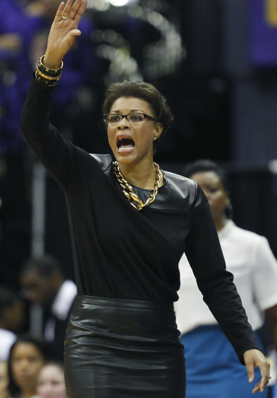 LSU basketball coach Nikki Caldwell signals her team in the second half of an NCAA college basketball first-round tournament game against Georgia Tech, Sunday, March 23, 2014, in Baton Rouge, La. LSU won 98-78. (AP Photo/Rogelio V. Solis)